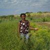 Agricultora exibe a sua plantação